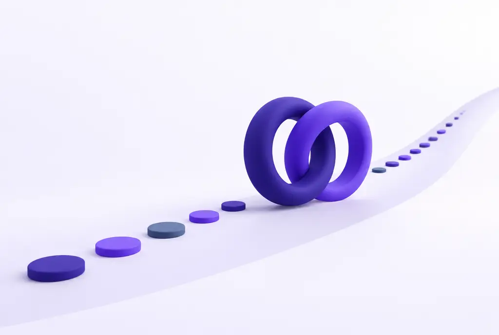 Two interlocking rings, one indigo and one violet, rolling forward along a rising path and leaving a trail of small discs.
